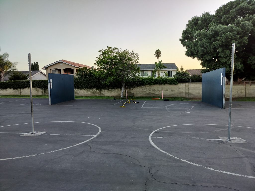 A11N Portable Pickleball net between 2 handball courts